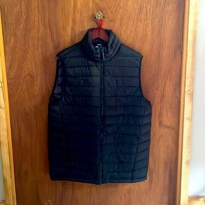 Mens black puffer vest, in like new condition.